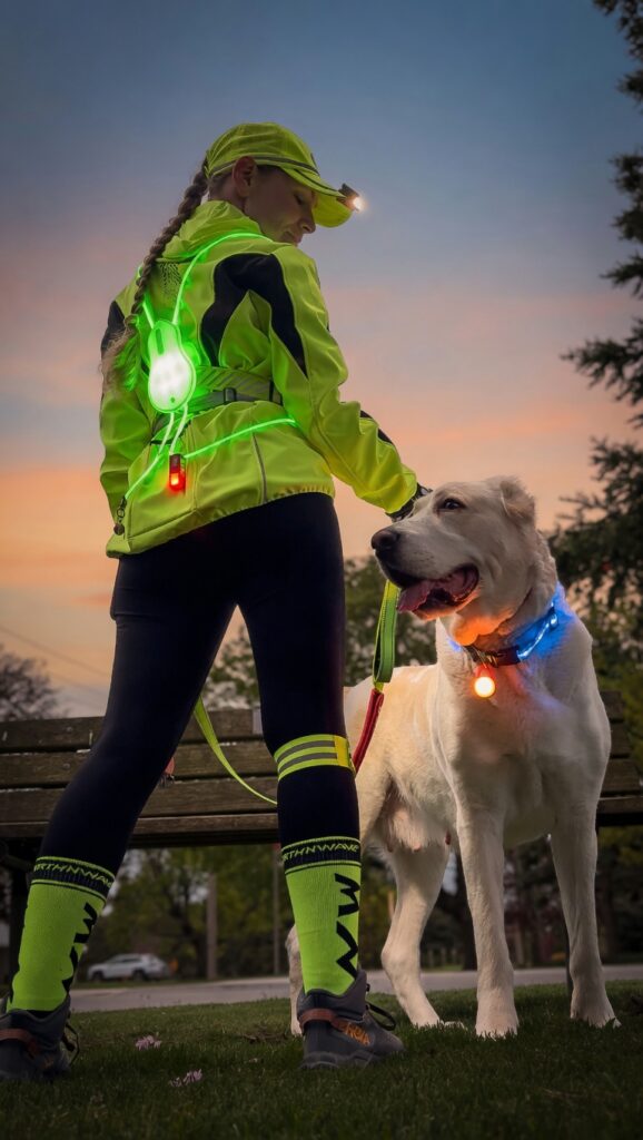 Neon reflective running jacket and glowing LED gear for woman and her white dog during early morning outdoor cardio walk - AliExpress finds for 2026